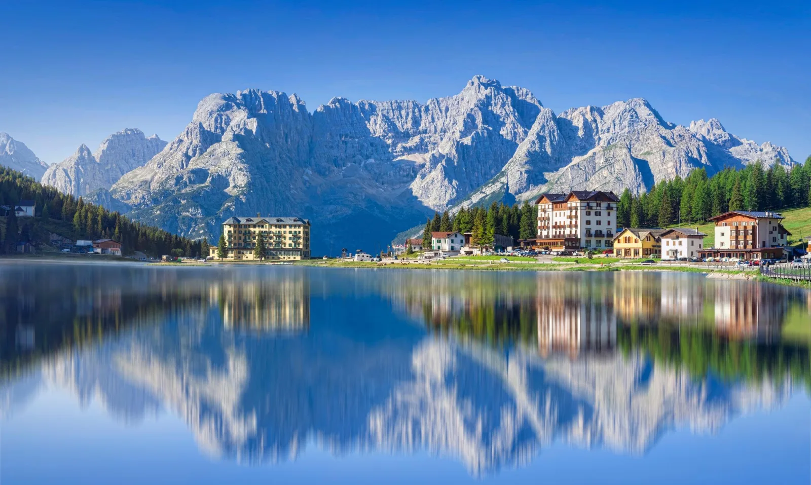 Lake Misurina mirroring the Sorapiss peaks with the Grand Hotel on the far shore